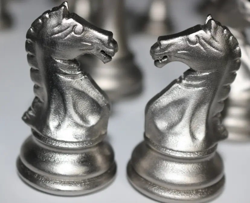 Metal 3D printed chess pieces with a glass bead blasted satin surface finish