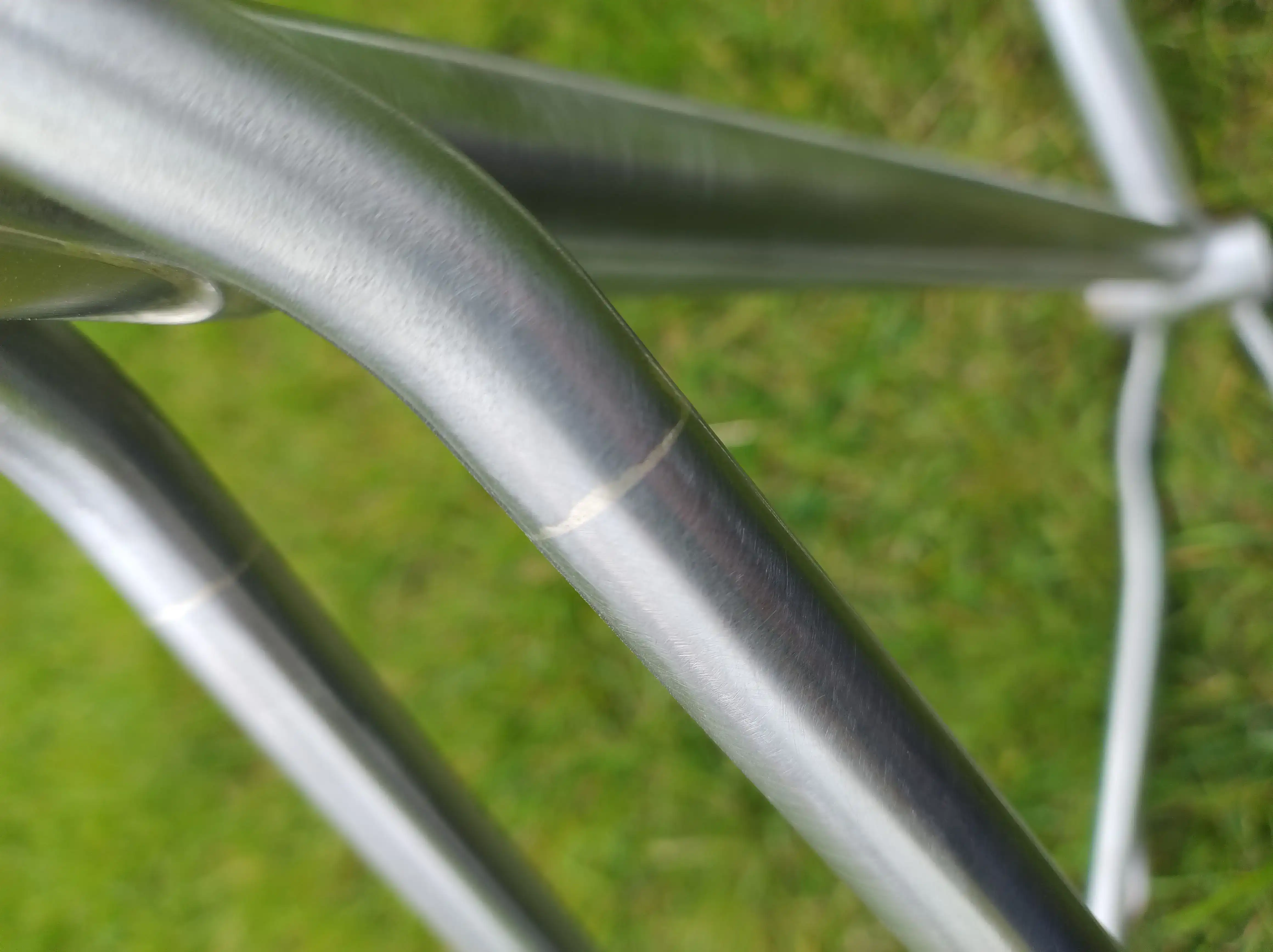 Close-up of a brushed joint on the custom titanium Project_D bike frame