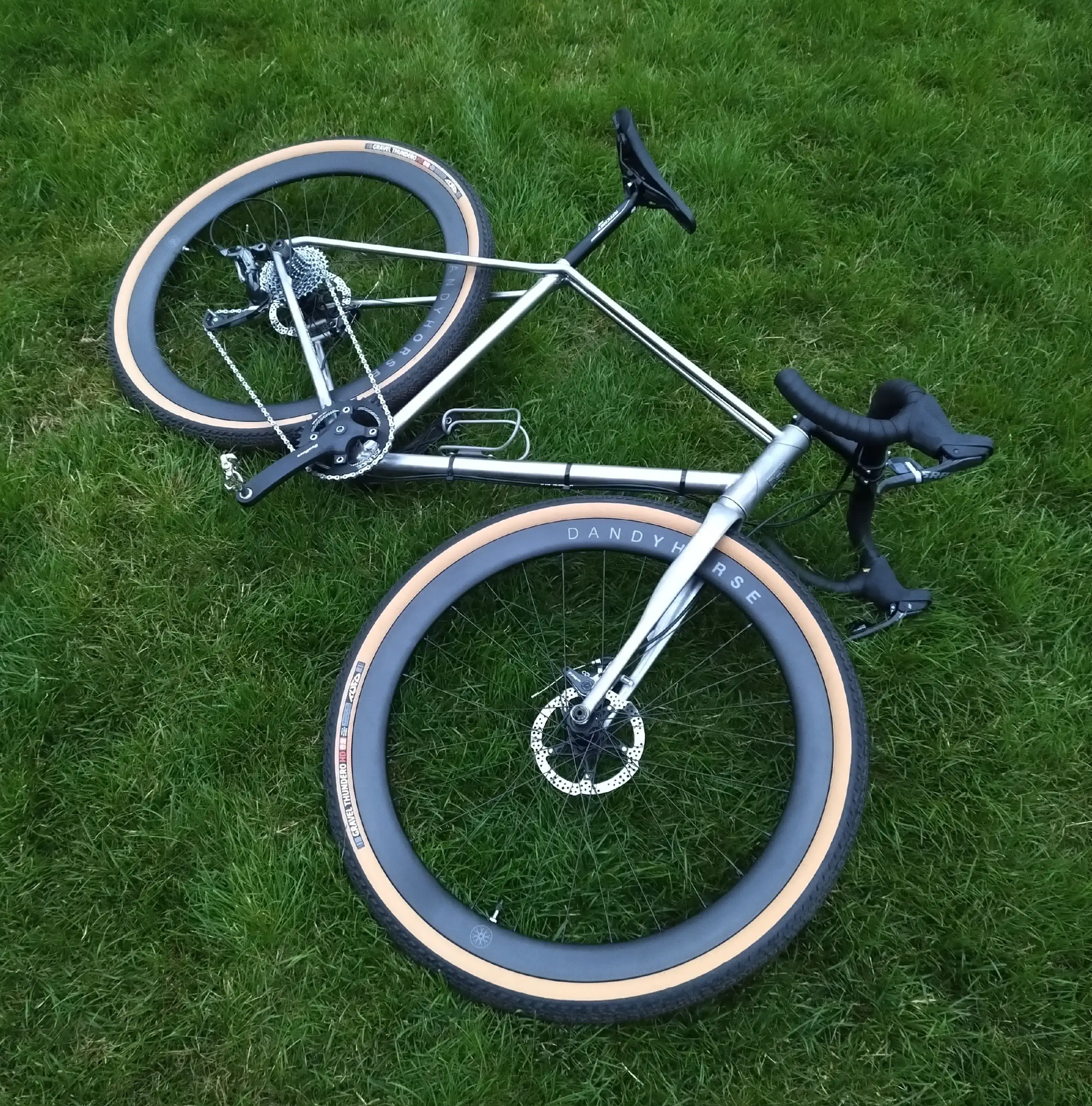Custom titanium gravel bike prototype fitted with wheels during the Project_D build