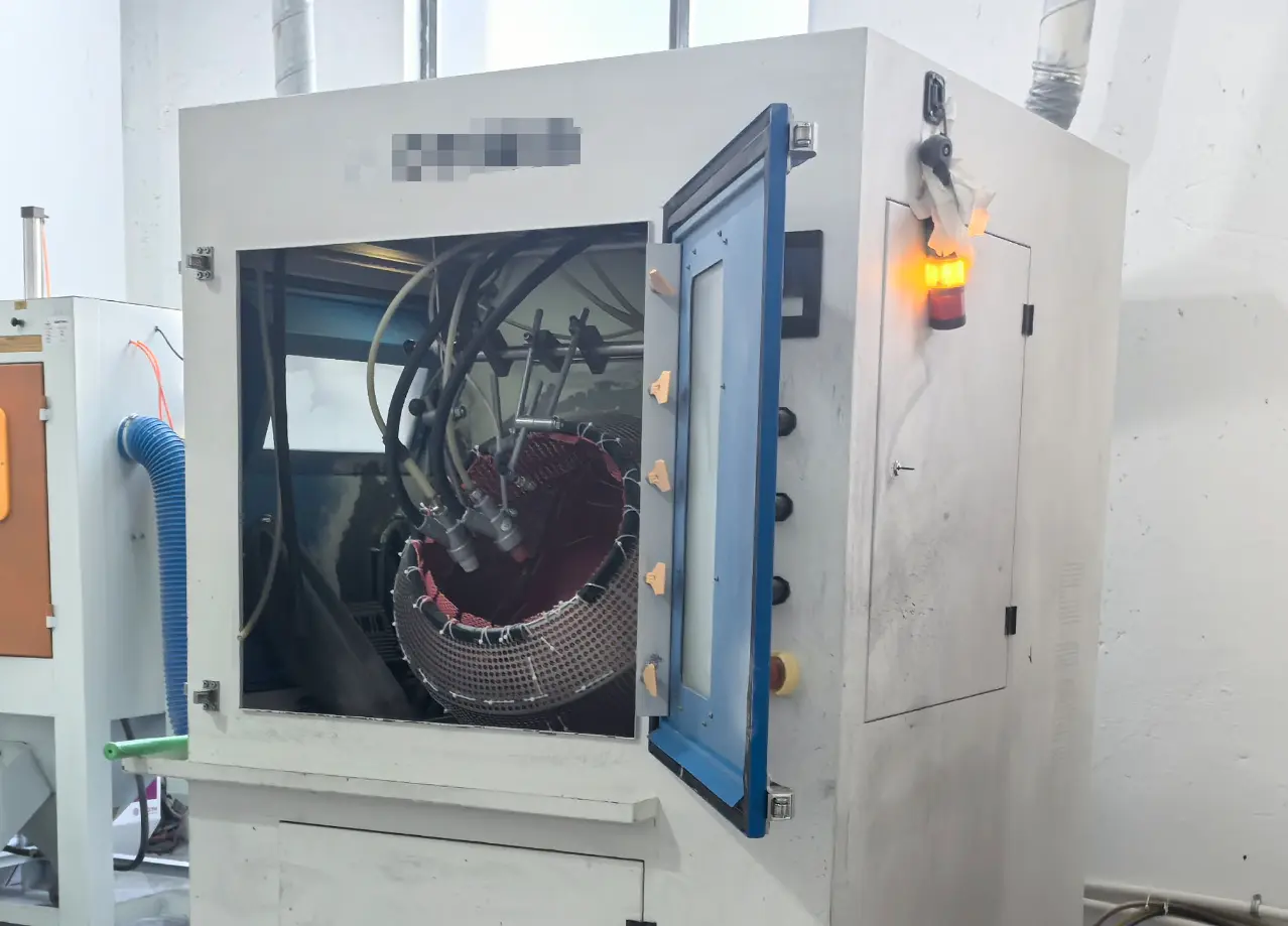 Industrial sandblasting machine used for surface finishing of metal parts before coating or painting