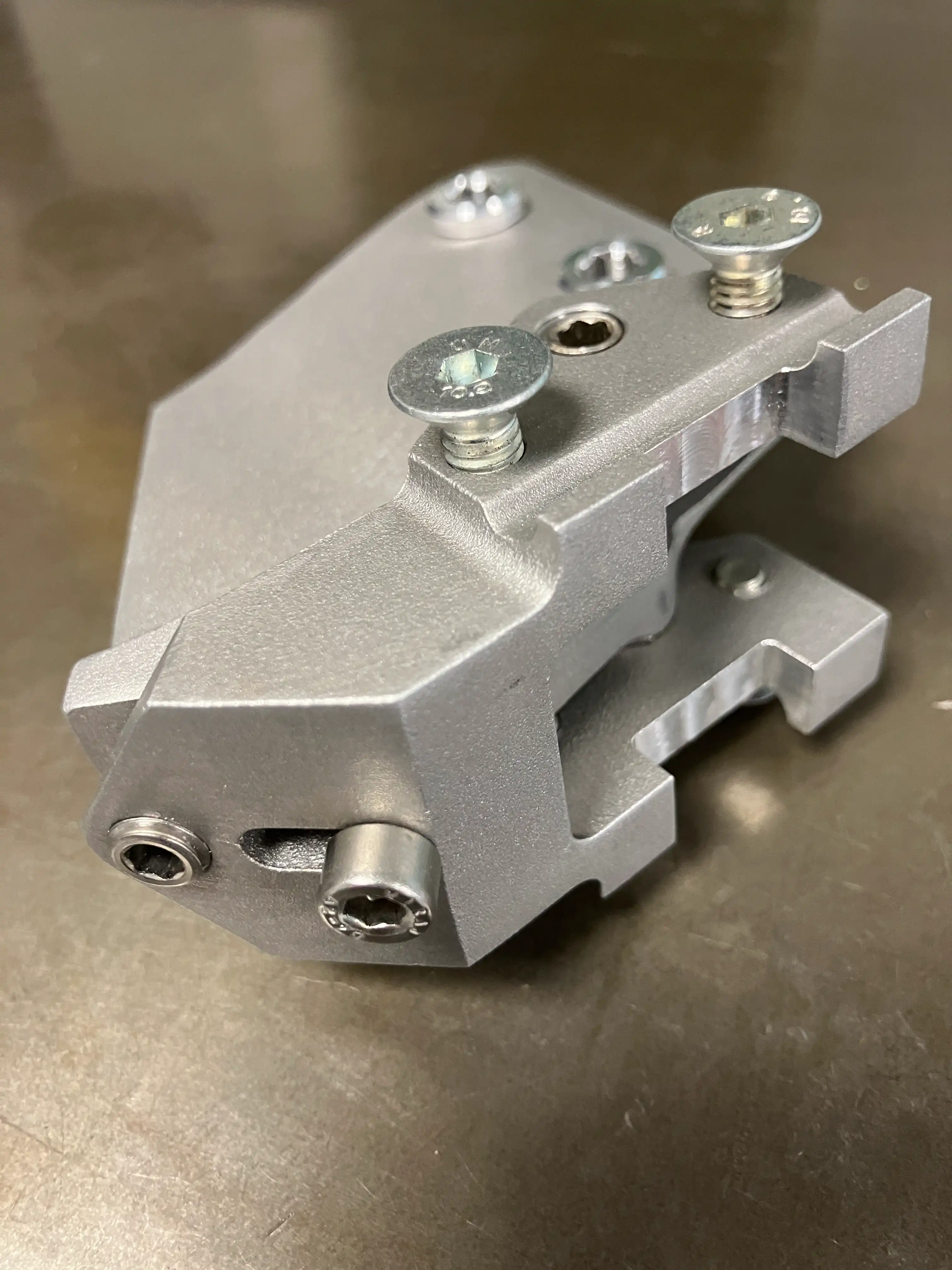 Close-up of the glass bead-blasted finish on the 3D printed Lotus 110 saddle clamp