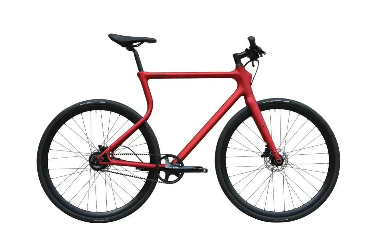 Red bicycle featuring a lightweight custom 3D printed frame designed for modern cycling applications