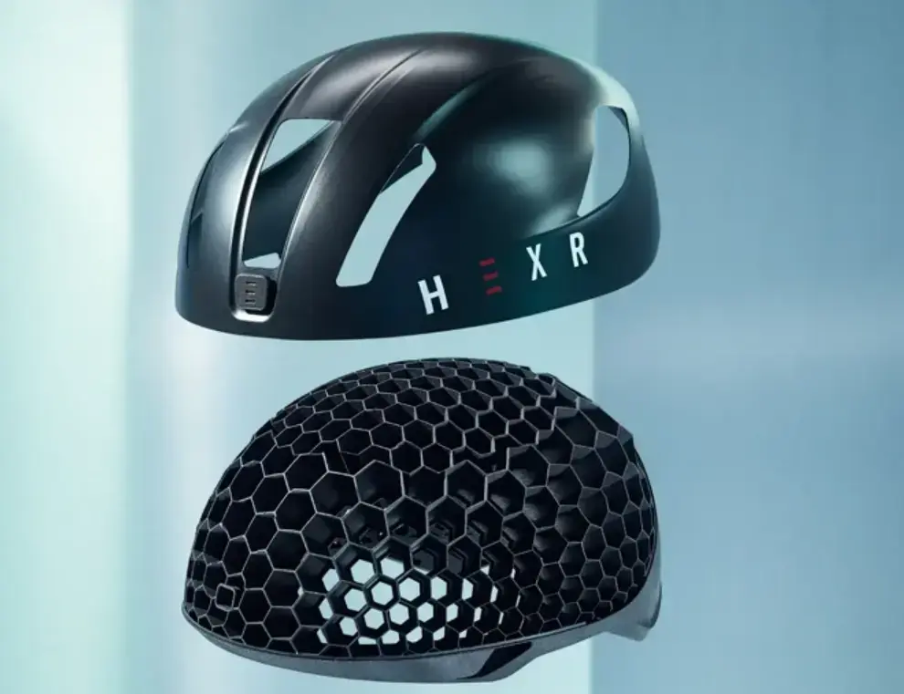 3D printed bicycle helmet featuring a lightweight honeycomb lattice structure and aerodynamic outer shell