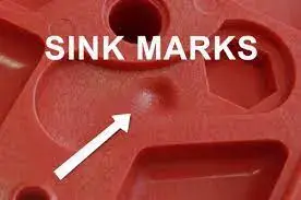 Injection molded plastic part showing sink marks as visible surface depressions