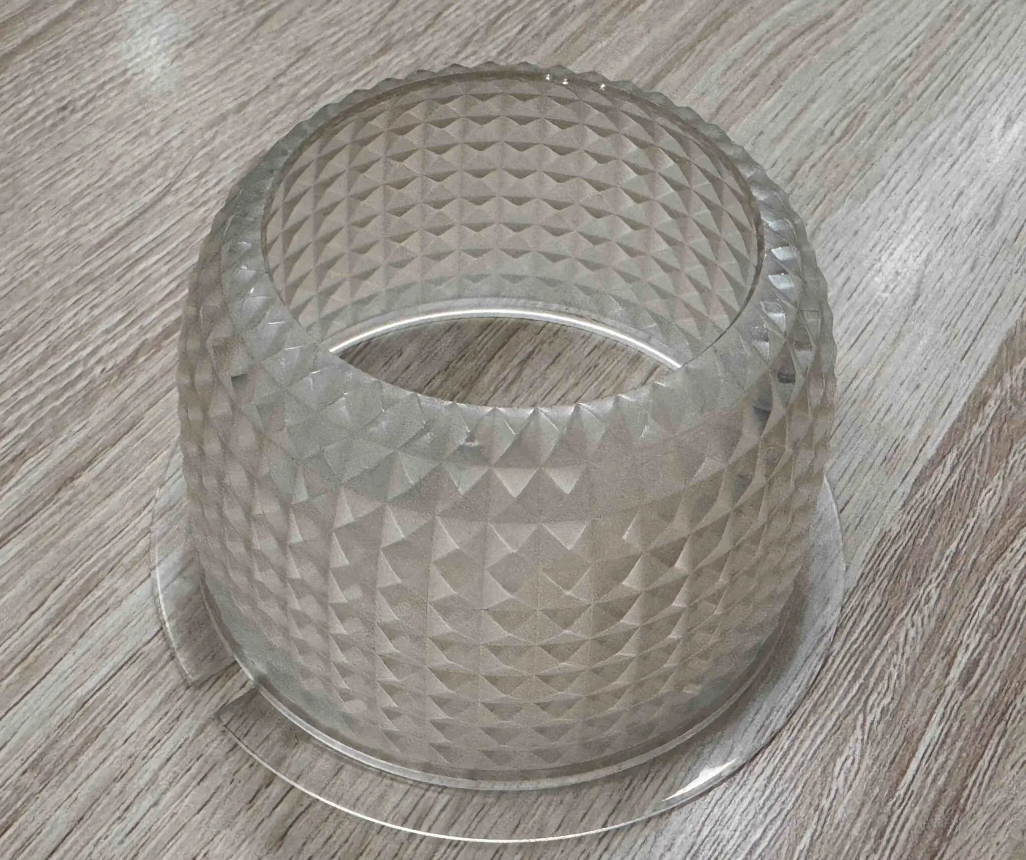 CNC machined acrylic part with textured matte surface and precision opening