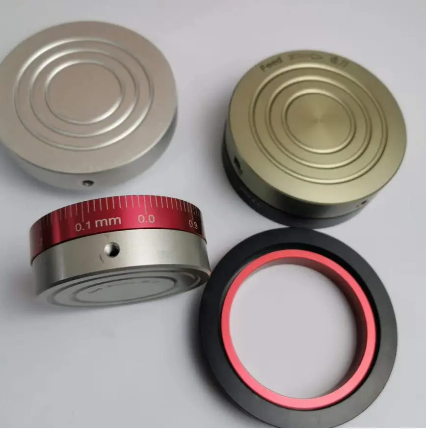 Precision machined metal components with circular grooves and fine adjustment markings