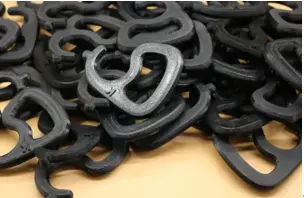 Black PETG 3D printed components with interlocking curved shapes